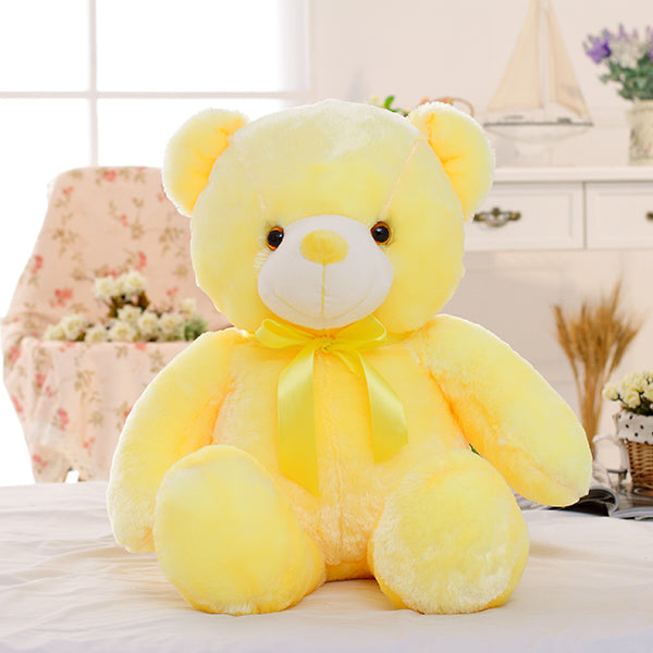 Glowing LED teddy bear in the dark