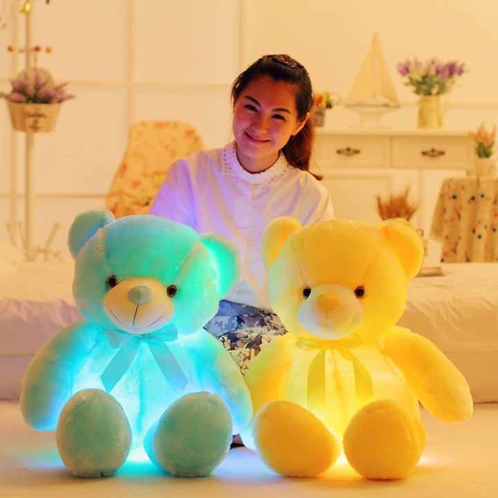 Glowing LED teddy bear in the dark