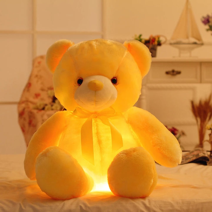 Glowing LED teddy bear in the dark