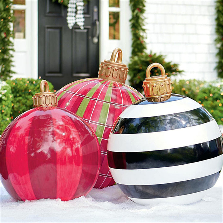 Giant inflatable Christmas bauble in garden