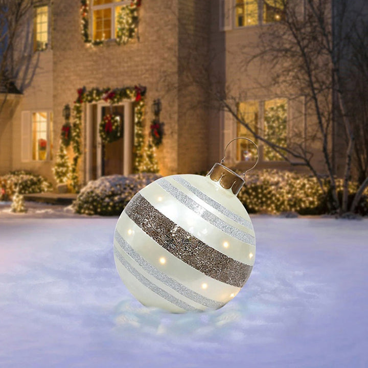 Giant inflatable Christmas bauble in garden
