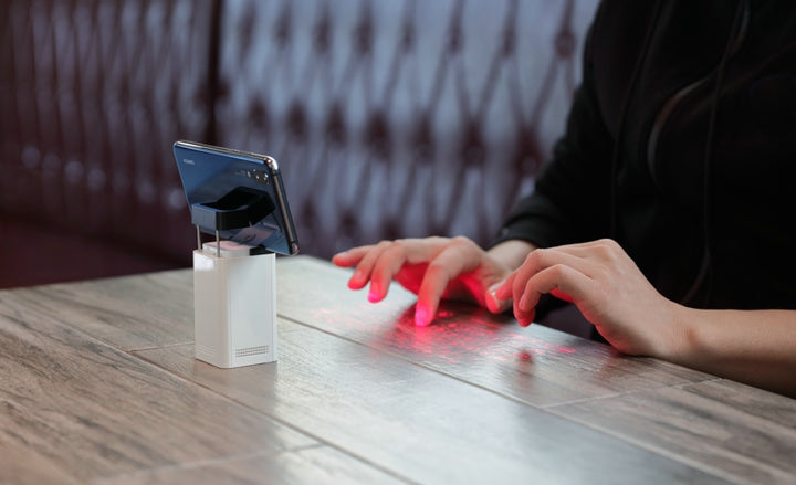 Laser projection keyboard on a desk