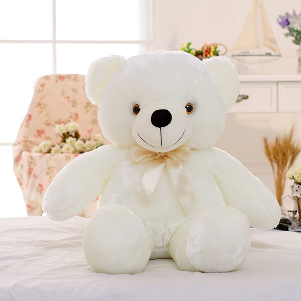 Glowing LED teddy bear in the dark