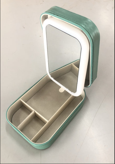 Makeup case with lit mirror open