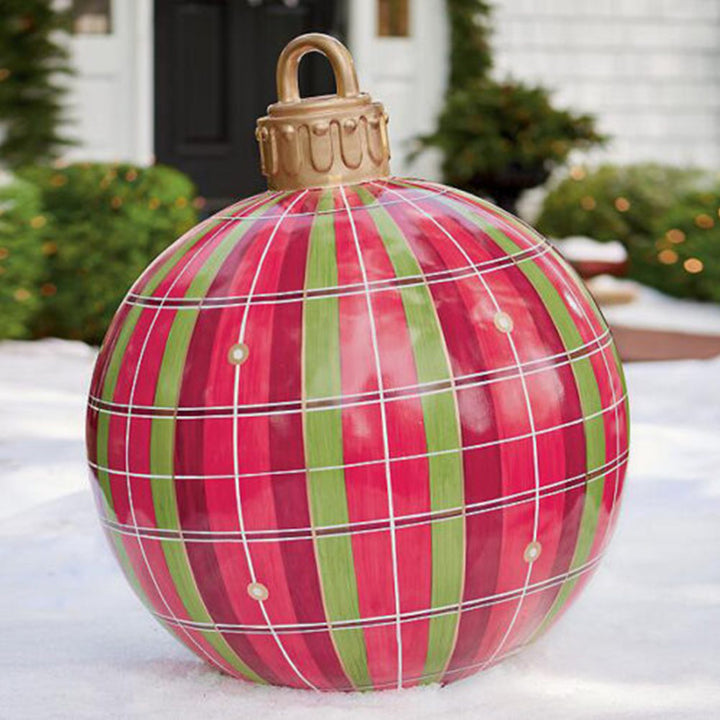 Giant inflatable Christmas bauble in garden