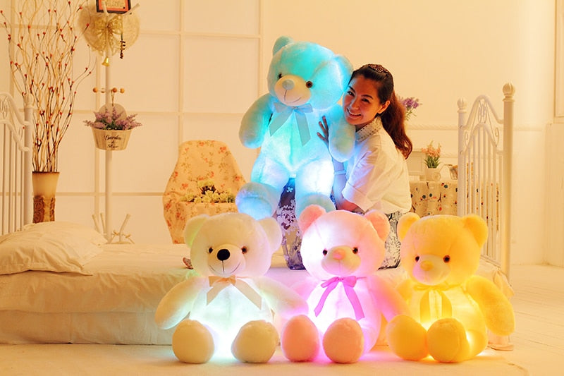 Glowing LED teddy bear in the dark