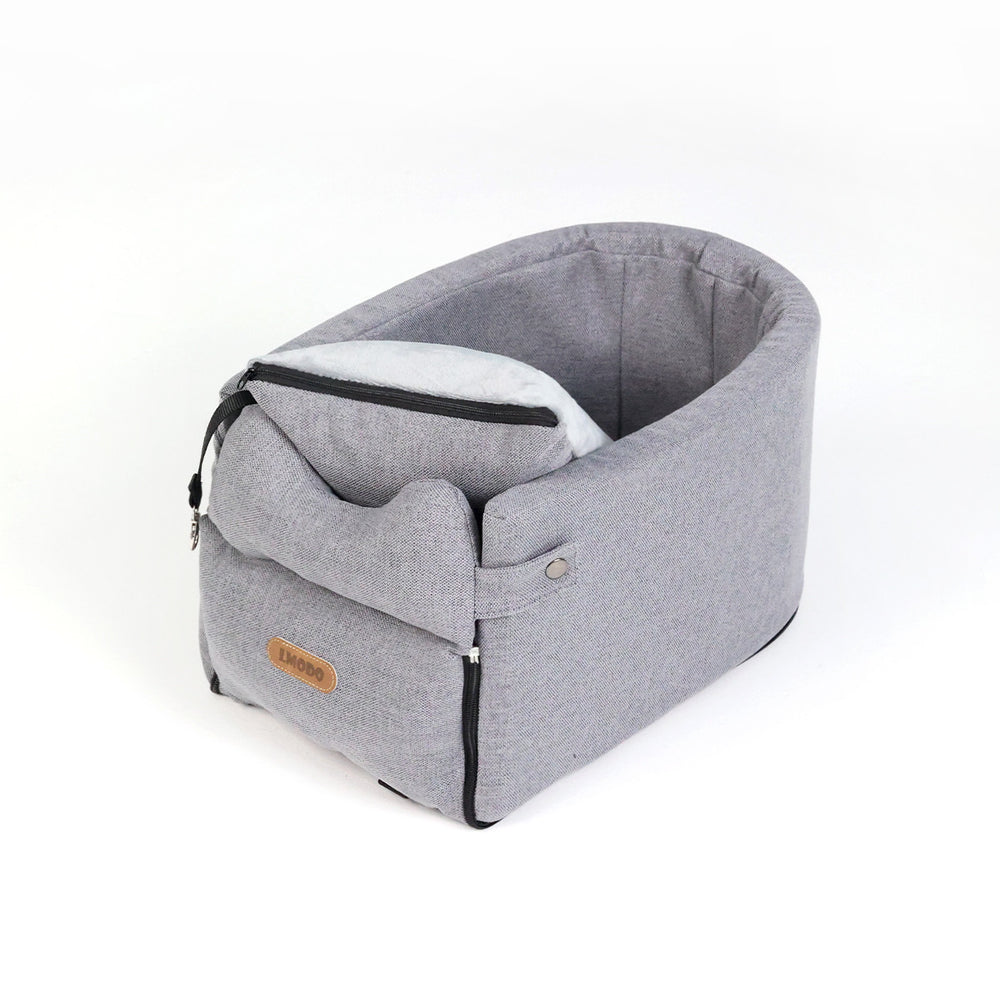 Small dog in armrest car seat