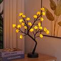 Rose tree lamp with glowing LED roses