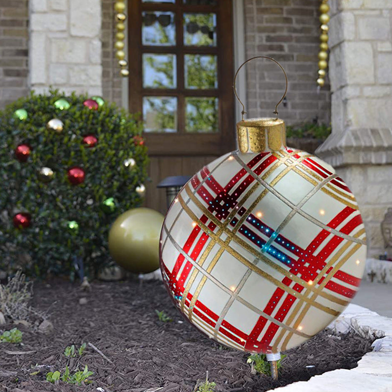 Giant inflatable Christmas bauble in garden