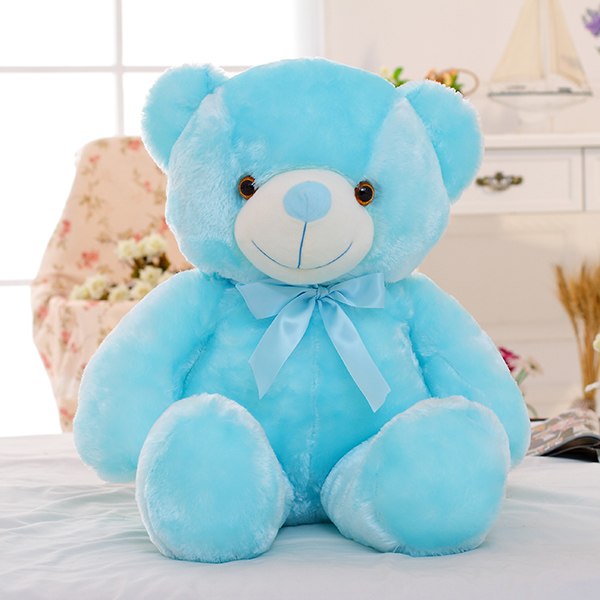 Glowing LED teddy bear in the dark