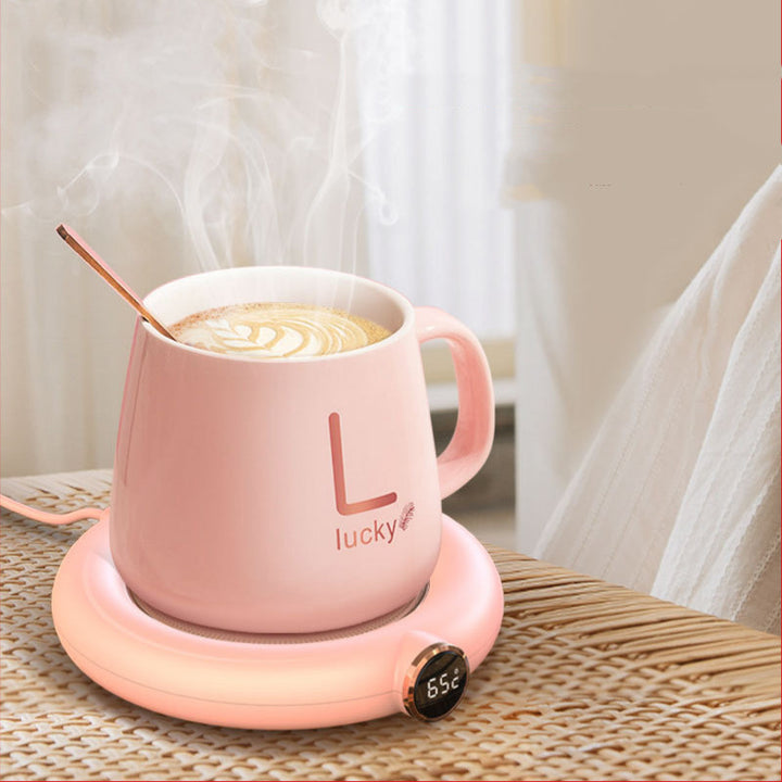 Mug warmer pad with coffee cup on desk