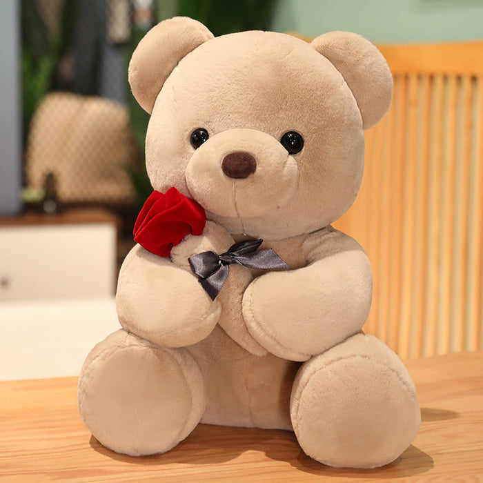 Plovena Plush teddy bear holding a red rose