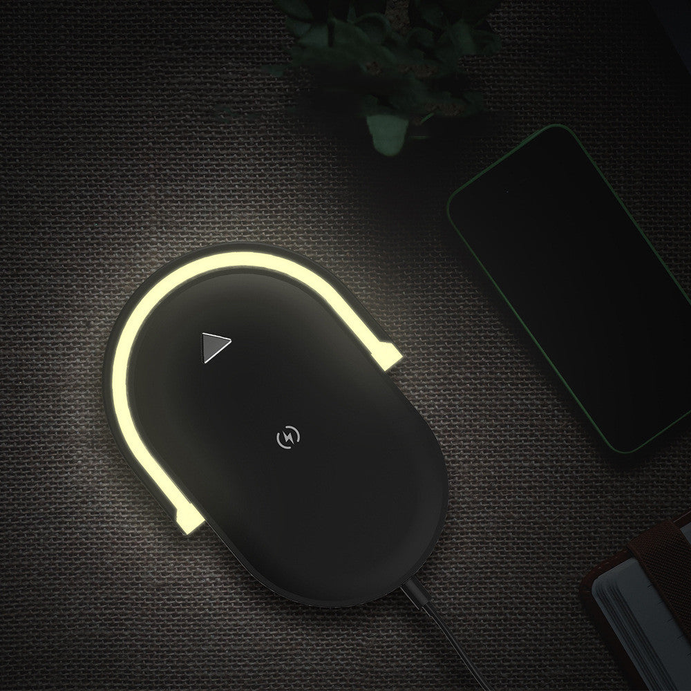 White foldable lamp charging a phone