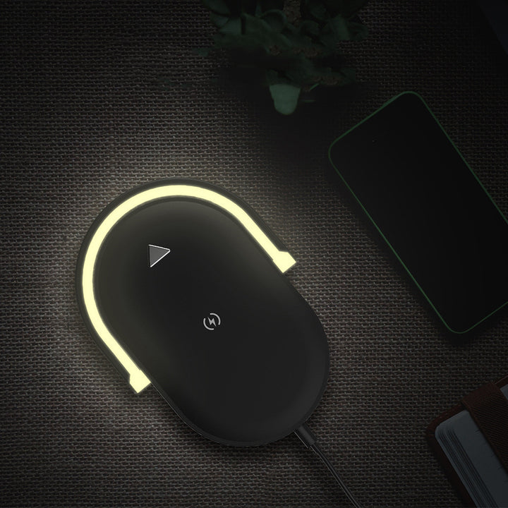 White foldable lamp charging a phone